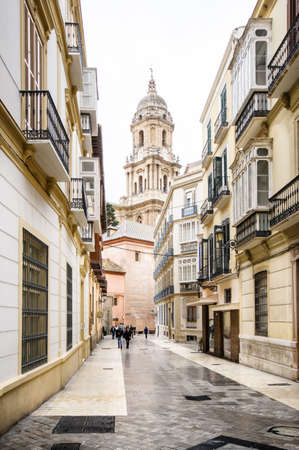MALAGA, SPAIN - FEBRUARY 08: tourists walk near cathedral on February 08, 2014 in Malaga, Spain. The cathedral was constructed between 1528 and 1782.のeditorial素材
