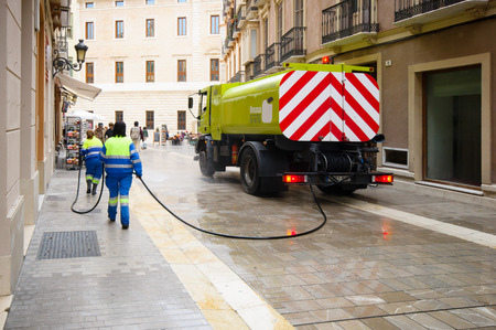 MALAGA, SPAIN - FEBRUARY 08: Cleaning workers in Cister Street on February 08, 2014 in Malaga, Spain. のeditorial素材
