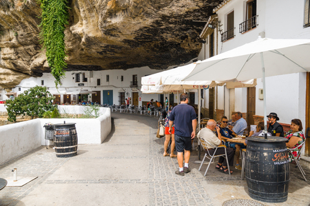 SETENIL DE LAS BODEGAS, SPAIN - SEPTEMBER 07: View of historic center on September 07, 2014 in Setenil de las Bodegas, Cadiz, Spain. Its centre is a typical Andalusian white-washed village.のeditorial素材