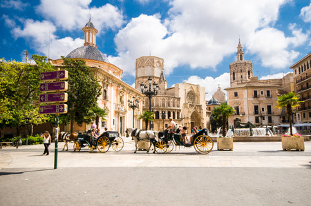 VALENCIA, SPAIN - JULY 14: tourist in Virgin square with the Basilica of the Desamparados Virgin on July 14, 2014 in Valencia, Spain. It was built between 1652 and 1666.のeditorial素材
