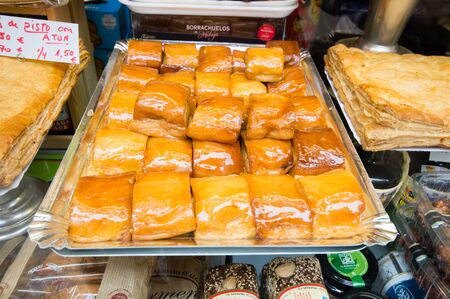 MALAGA, SPAIN - MARCH 01:Torrijas in a market on March 01, 2014 in Malaga, Spain.Typical spanish dessert with honey in Easter Season.のeditorial素材