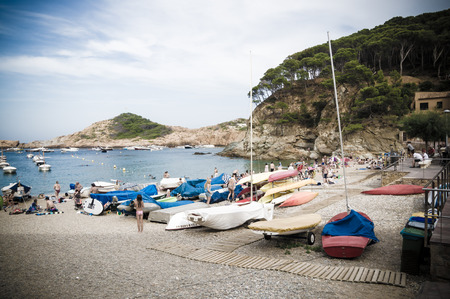 COSTA BRAVA, SPAIN - JULY 19: : Tourists relax on July 19, 2014 in Girona, Catalonia, Spain. The Costa Brava is a popular tourist region that welcomes millions of people annually.のeditorial素材