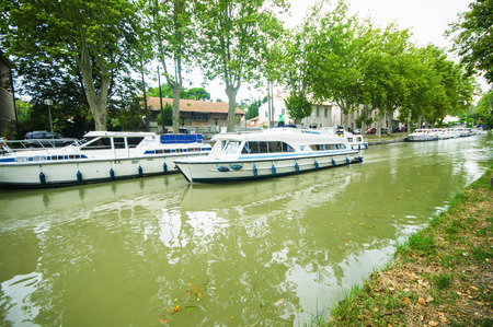CARCASSONNE,FRANCE - JULY  25: boats anchored at the famous Canal du Midi  on July 25, 2014 in Carcassonne, France. The Canal is a 241 km (150 mi) long canal in Southern France.のeditorial素材