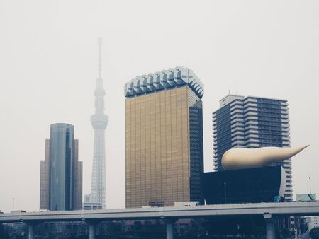 TOKYO, JAPAN - MARCH 18: Tokyo Skytree and Asahi Beer Hall  along the Sumida River on March 18, 2015 in Tokyo, Japan.のeditorial素材