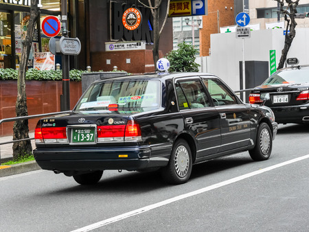 TOKYO, JAPAN - MARCH 19: traditional taxi in Hanzomon district on March 19, 2015 in Tokyo, Japan.のeditorial素材