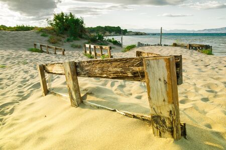 wooden fence in a beachの写真素材