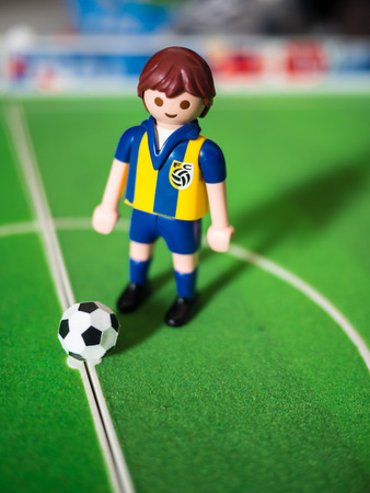CIRCA - JULY 16: Playmobil soccer figure on July 16, 2015. Playmobil are famous construction toys manufactured by the Brandstaetter Group, Germany.のeditorial素材