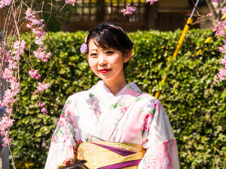 ARASHIYAMA, JAPAN - MARCH 29: Unidentified Japanese ladies with Kimono dress, Japanese traditional costume on March 29, 2015 in Arashiyama, Japan. It is a district on the western outskirts of Kyoto.のeditorial素材
