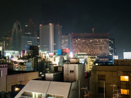 TOKYO, JAPAN - MARCH 29: Shinjuku district on March 29, 2015 in Tokyo, Japan.  It is a major commercial and administrative centre, housing the busiest railway station in the world.のeditorial素材