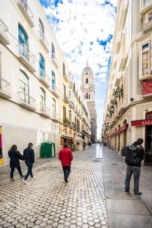 MALAGA, SPAIN - JANUARY 16: City street with tourists at daytime on January 16 in Malaga, Spain. It is the second most populous city of Andalusia and the sixth largest in Spain.のeditorial素材