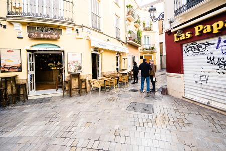 MALAGA, SPAIN - JANUARY 16: City street with tourists at daytime on January 16 in Malaga, Spain. It is the second most populous city of Andalusia and the sixth largest in Spain.のeditorial素材