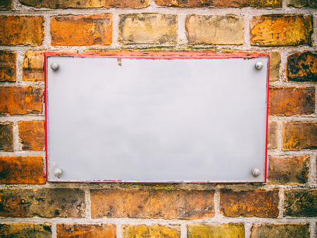 White empty board on brick wall.の写真素材