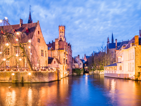 BRUGES, BELGIUM - DECEMBER 12: Illuminated river in the evening on December 12 in Bruges, Belgium. It is a city and a municipality located in the Flemish region.のeditorial素材