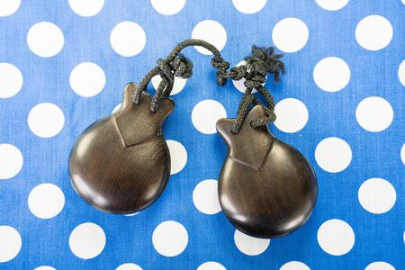 castanets, blue dotted backgroundの写真素材