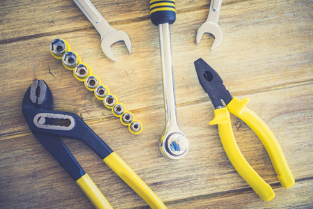 Close-up of different working tools on wooden tableの写真素材