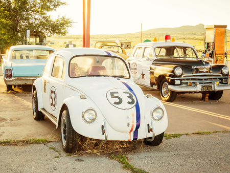 PEACH SPRINGS, USA - SEPTEMBER 06: old cars in historic Route 66 on September 06, 2015 in Peach Springs, Arizona, United States. Route 66 was established on November 11, 1926.のeditorial素材