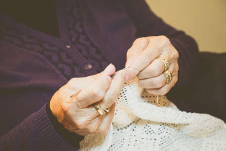 Close-up of woman's hands crocheting