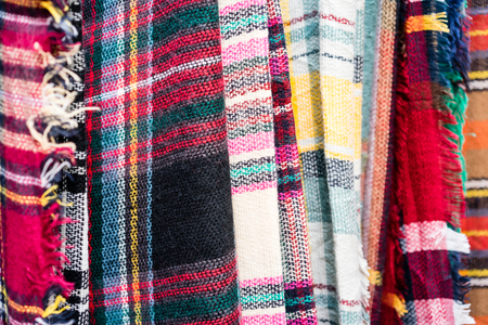 Hanging scarfs in shop