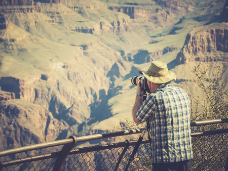 GRAND CANYON, ARIZONA, USA - SEPTEMBER 06: Unidentified person look at the Grand Canyon on September 06, 2015 in Arizona, United States. It is a steep-sided canyon carved by the Colorado River.のeditorial素材