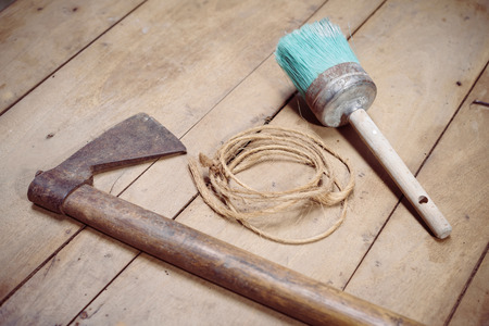 Close-up of three tools on wooden background