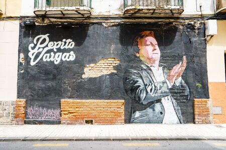 MALAGA,SPAIN - 28 MAY 2016:Graffiti with man clapping on black background. UPHO Festival.のeditorial素材