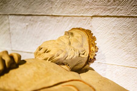 LA RIOJA,SPAIN - 29 AUGUST,2016:Low perspective of statue of king in golden crown against of stone...