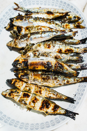 Close-up of heap of grilled fish on plateの写真素材