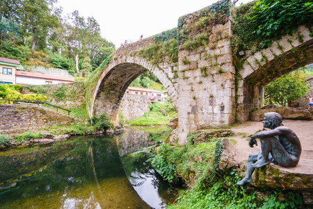 CANTABRIA,SPAIN - 31 AUGUST,2016: Fishman statue in Lierganes at riverのeditorial素材