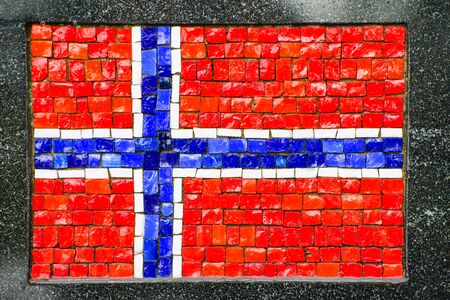 Picture of Norwegian flag made of little mosaic tiles on grey textured background. の写真素材