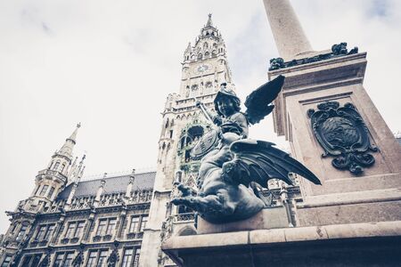 View on famous ancient Marienplatz in sunlight against of blue sky in Munich,Germanyのeditorial素材