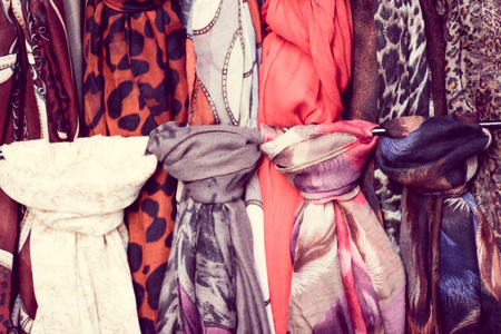 The different colored scarfs in the store.の写真素材
