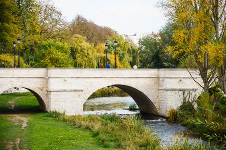 Burgos, Spain - 10.11.2016: View of old pedestrian bridge under Alazon  river on nature background.のeditorial素材