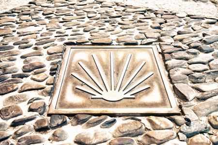 Way of St. James  - 12.09.2016 From above shot of yellow scallop shell symbol on concrete.のeditorial素材