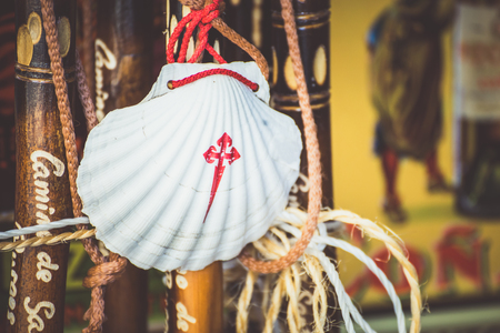 Way of St. James  - 10.11.2016 Front view of Scallop shell symbol hanging on blurred background.のeditorial素材