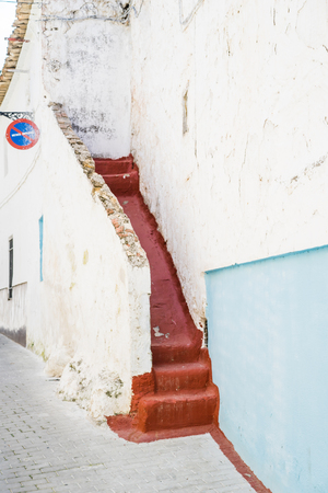 The stairs outside bumping into the wall. Vertical outdoors shot.の写真素材
