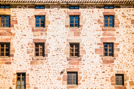 The exterior of an old stone-made house in a sunny day.の写真素材