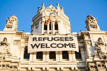 Madrid city hall, Spain - 09.10.2016. A sign  messaging refugees welcome.のeditorial素材