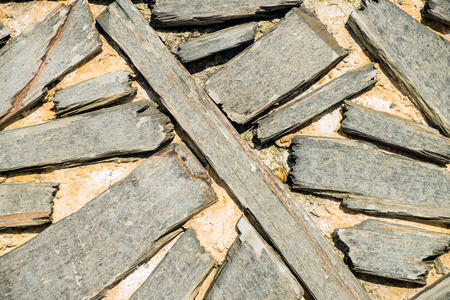 The wall with the abstract placed rough planks in it.の写真素材