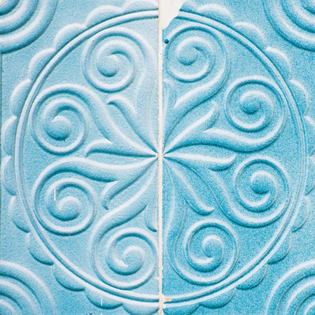 The two halves of blue colored tile ornament with the shear.の写真素材