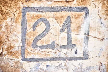The two and one numerals in square are drawn on cracked wall.の写真素材