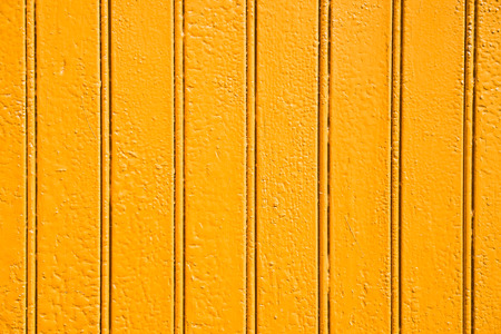 The woods painted with the orange color with the vertical stripes.の写真素材