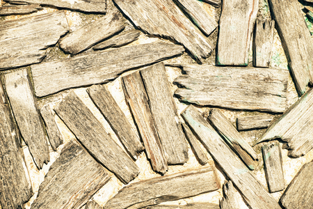 The wall with the abstract placed rough planks in it.の写真素材