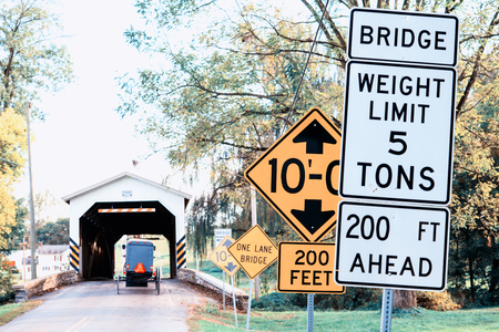 Different road sign placed before bridge in Lancaster, Pennsylvania, USA.の写真素材