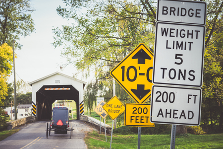 Different road sign placed before bridge in Lancaster, Pennsylvania, USA.の写真素材