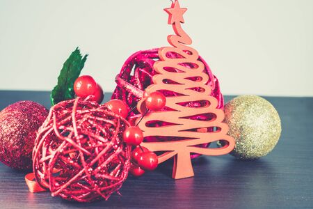 Studio shot of Christmas glittery decorations on wooden table. の写真素材
