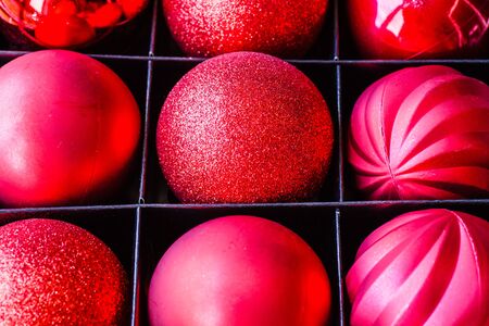 Close up of red Christmas balls in box. の写真素材
