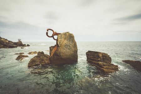 BASQUER COUNTRY,SPAIN - 29 AUGUST,2016:View of iron rusty comb of the wind sculpture on coast of Mediterranean seaのeditorial素材