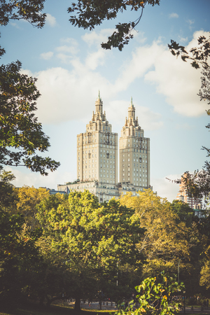 Central Park, New York, USA - 23 October, 2016: two towers of aged building from central parkのeditorial素材