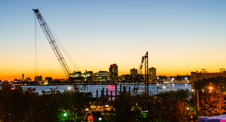 Chelsea District, New York, USA - 23 October, 2016: peaceful view to Hudson river and illuminated skyscrapersのeditorial素材