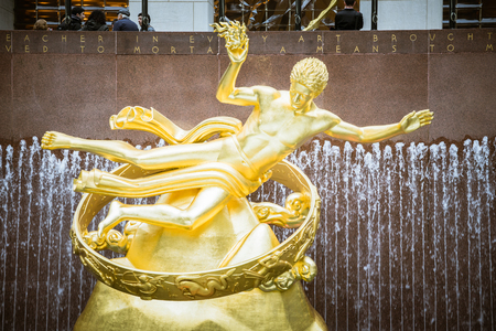 Rockefeller Garden, New York, USA - 22 October, 2016: big golden statue standing in fountainのeditorial素材